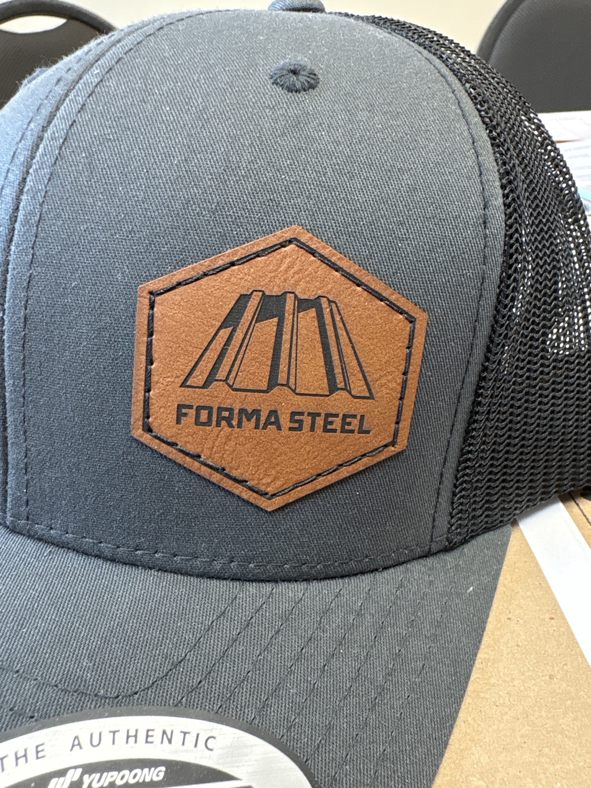 Forma Steel custom hat — Faux-leather patch trucker