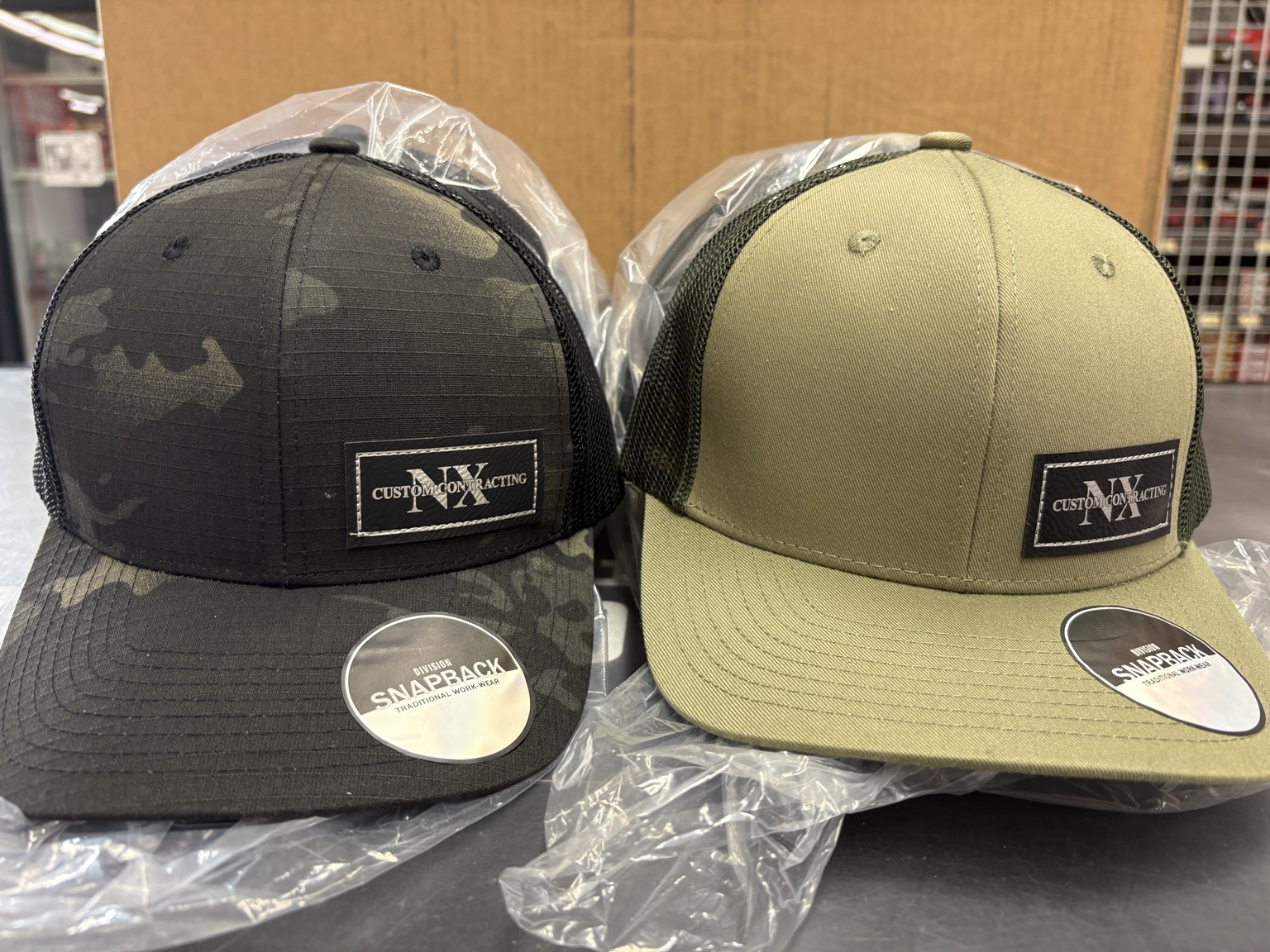 NX Custom Contracting custom hat — Two-colour branded cap set